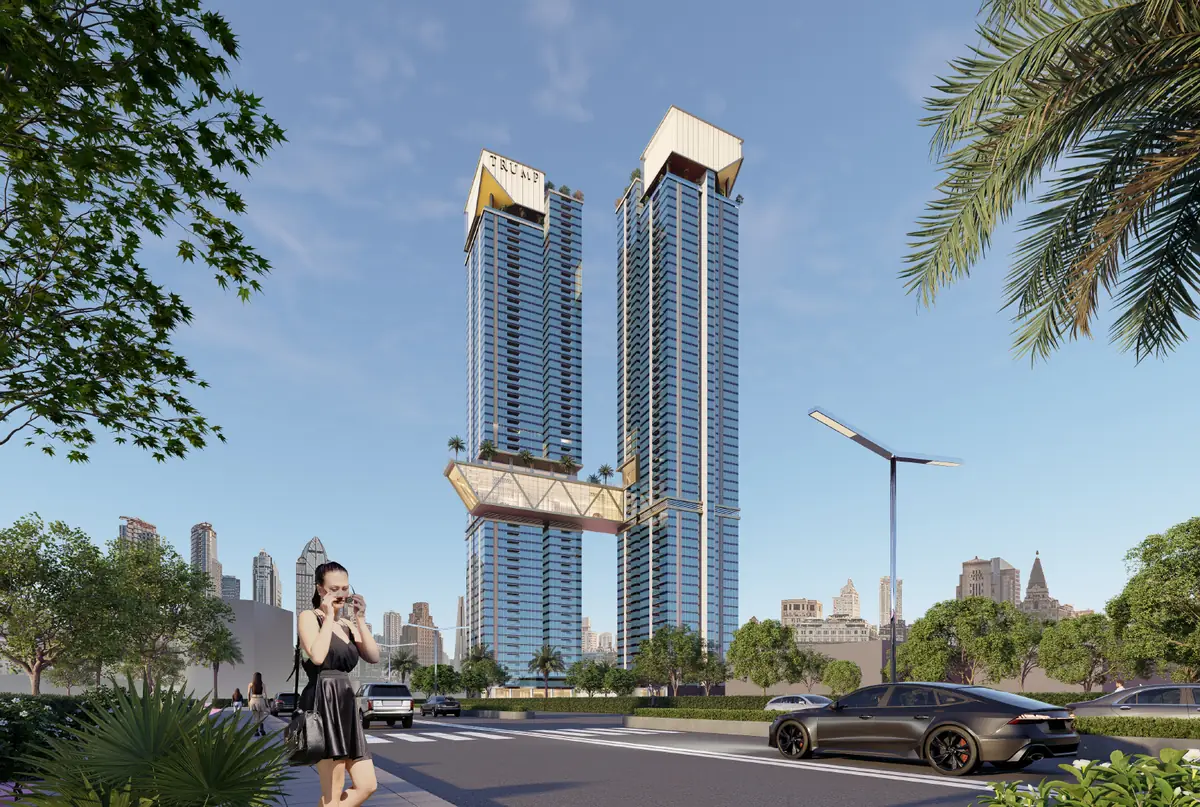 Twin towers of Trump Towers Hyderabad from street level with the sky bridge visible